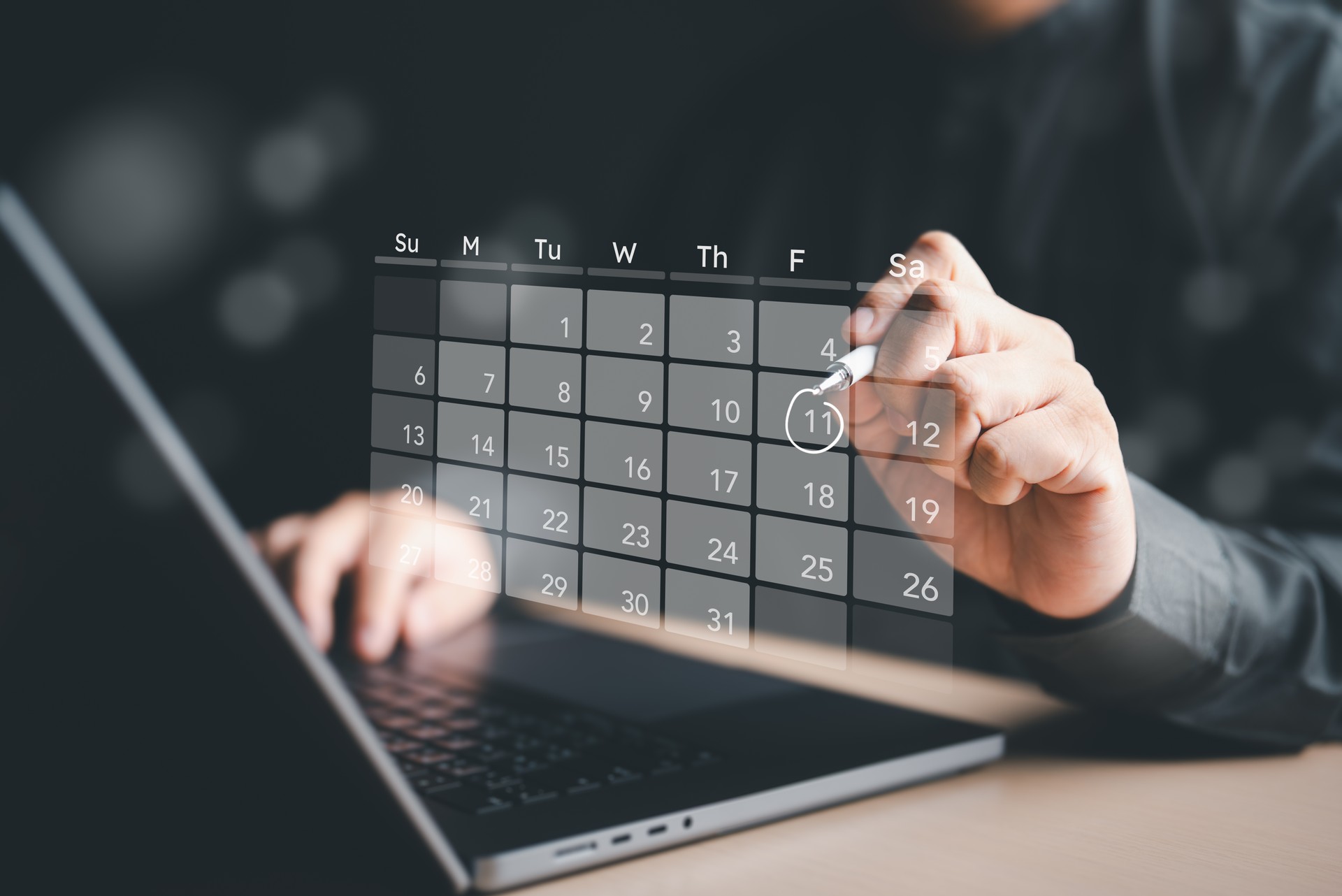 Schedule time management for time effective work. Agenda events information and meeting organizer. Businessman or secretary uses a computer to make appointment reminders or meeting agenda on calendar.